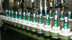 Close Up toothpaste being inserted on the tubes in the automated production belt.